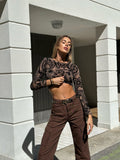 Top nude ricami nero