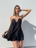 Abito in raso nero con punto luce