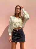 Gonna di jeans con borchie e trasparenze nera