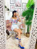 Top floreale con cintura
