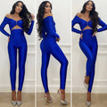 Tuta aderente blu con spilla silver