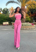 Tuta con piume rosa