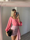Top con bottoncini rosa