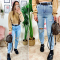 Jeans con strappi e cintura compresa