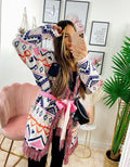 Cardigan A rombi dettagli rosa con frange e cinta