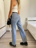 Jeans wide leg con strappi e dettaglio