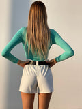 Short in ecopelle bianco con cintura