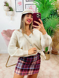 Cardigan con bottoni gioiello e spalle scoperte panna