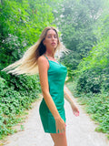 Abito a bretellina verde con incroci