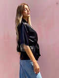 Blusa o kimono con frange