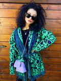 Cardigan verde con frange e cinta