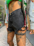 Short in jeans nero con borchie