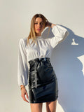 Abito con camicia di raso e gonna in ecopelle