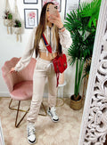 Tuta sportiva beige con cappuccio