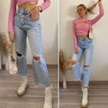 jeans con dettaglio aperture e catene