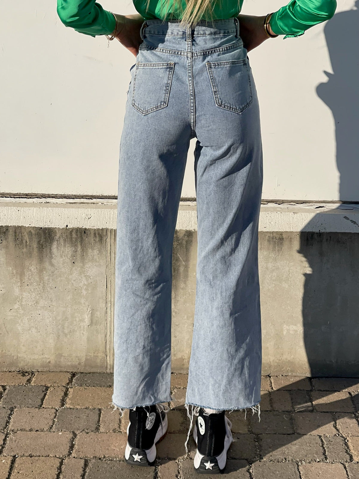 Jeans wide leg con strappi e dettaglio