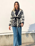 Cardigan zebrato nero con frange e cinta