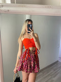 Top rosso con spalline in strass