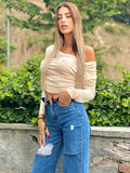 Top beige morbido con scollo