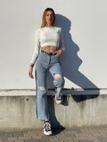 Jeans wide leg con strappi e dettaglio