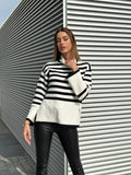 Maglione a righe collo alto