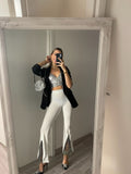 Pantaloni a zampa con strass bianco