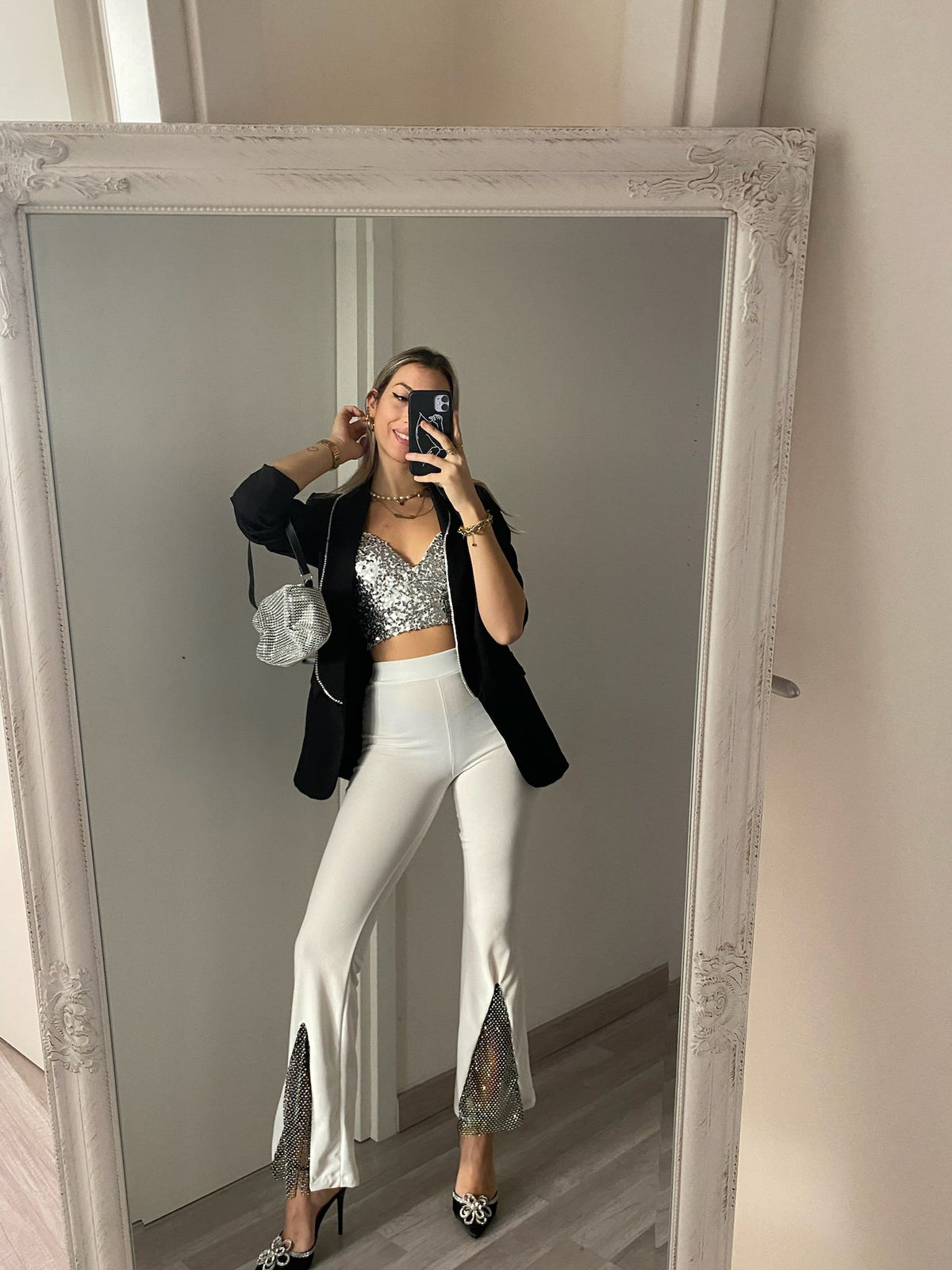 Pantaloni a zampa con strass bianco