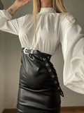 Abito con camicia di raso e gonna in ecopelle