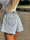 Short jeans a farfalla con strappini