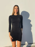Abito nero con drappeggio