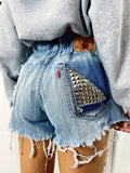 Short Levi’s Vintage bagno chiaro con borchie
