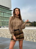 Maglione beige con trecce