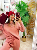 Completo maglia e pantalone rosa