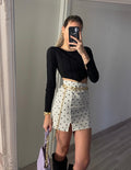 Maglia crop nera a costine con V