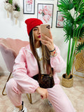 Completo sportivo con righe Rosa
