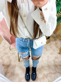Jeans con strappi e borchie argento