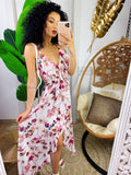 Abito con gonna asimmetrica e fiorellini rosa