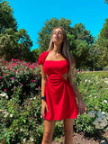 Abito rosso schiena incrociata