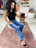 Jeans con bottoni in strass