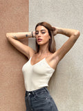 Top a costine beige spalline oro