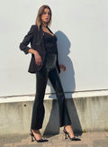 Pantalone in ecopelle con spacco