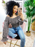 Blusa con rouge e fiorellini