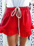 Short rosso con arricciatura