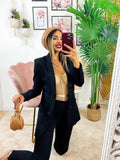 Body con trasparenze e catena nude