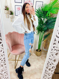 Jeans con strappi e borchie argento