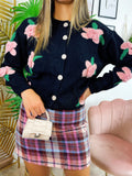 Cardigan nero con rose