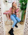 Jeans con borchie posteriori grandi