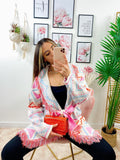 Cardigan A rombi bianco con frange e cinta