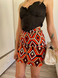 Gonna geometrica arancio nero