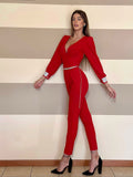 Tuta rossa schiena aperta e strass